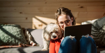 Women using device with her dog