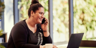 Woman on the phone sitting at a desk