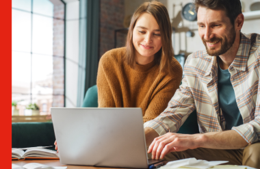 A couple at a laptop refixing their mortgage