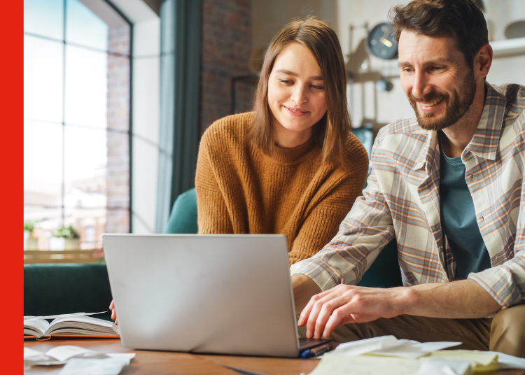 A couple at a laptop refixing their mortgage