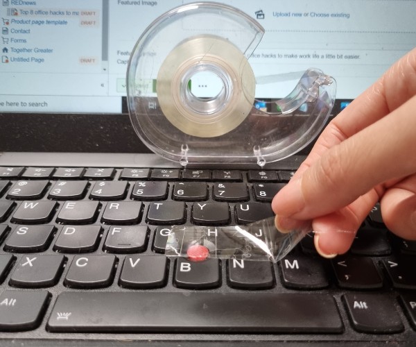 Photo of a keyboard being cleaned.